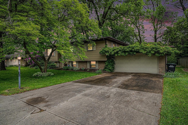 6291 Fallen Timbers Ave, Portage, IN 46368 - split level home with concrete driveway, brick siding, a lawn, and an attached garage