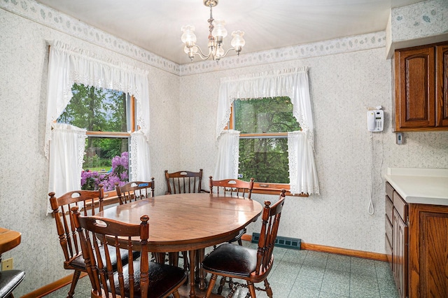 6291 Fallen Timbers Ave, Portage, IN 46368 - dining space featuring a chandelier, baseboards, and wallpapered walls