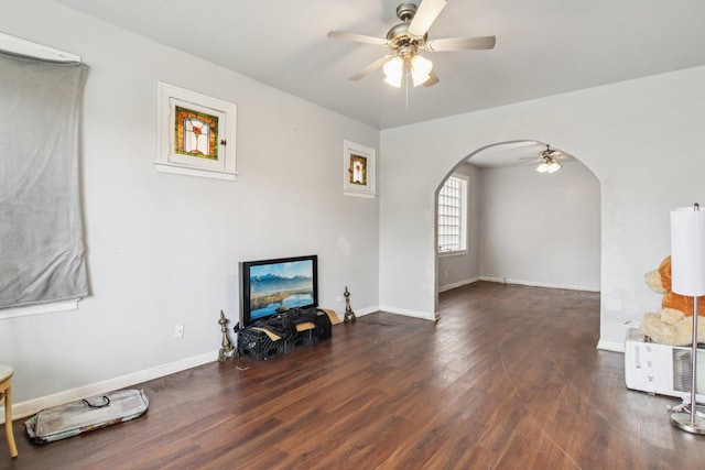8136 S Manistee Ave, Chicago, IL 60617 - living area with arched walkways, ceiling fan, and wood finished floors