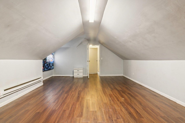8136 S Manistee Ave, Chicago, IL 60617 - bonus room featuring wood finished floors, vaulted ceiling, and a baseboard heating unit