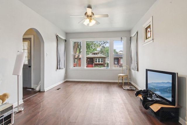 8136 S Manistee Ave, Chicago, IL 60617 - living room with a ceiling fan, wood finished floors, and arched walkways