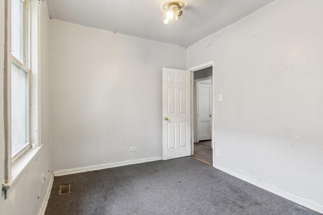 8136 S Manistee Ave, Chicago, IL 60617 - carpeted empty room featuring baseboards