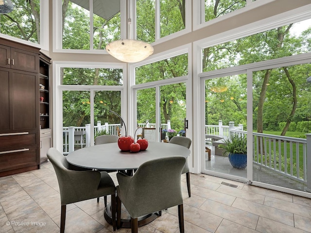 28W535 Purnell Rd, West Chicago, IL 60185 - sunroom featuring tile patterned floors, a towering ceiling, and healthy amount of natural light