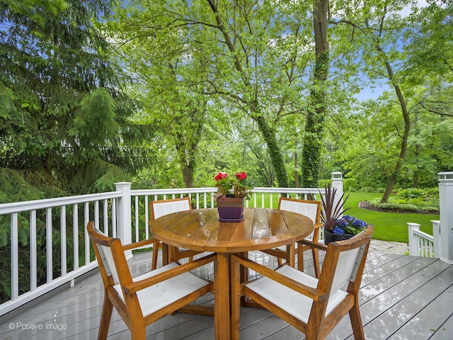 28W535 Purnell Rd, West Chicago, IL 60185 - wooden deck with outdoor dining space and a lawn