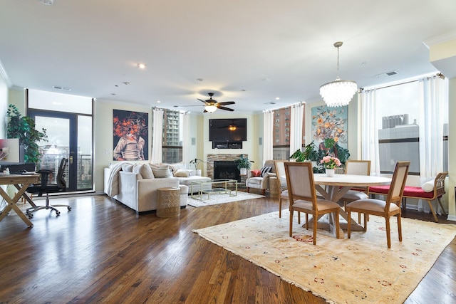 910 S Michigan Ave Unit 1411, Chicago, IL 60605 - dining area with ceiling fan, a fireplace, a desk, dark wood finished floors, and ornamental molding