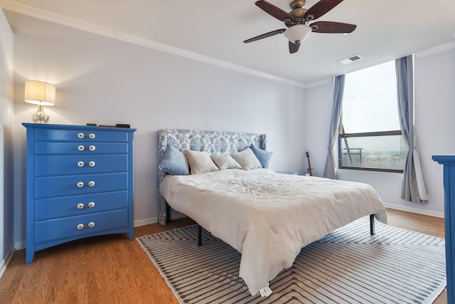 910 S Michigan Ave Unit 1411, Chicago, IL 60605 - bedroom featuring crown molding, wood finished floors, and a ceiling fan