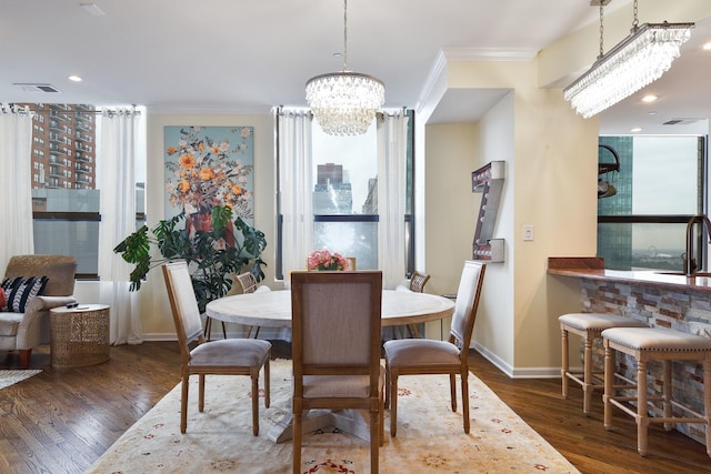 910 S Michigan Ave Unit 1411, Chicago, IL 60605 - dining area with a chandelier, ornamental molding, and wood finished floors