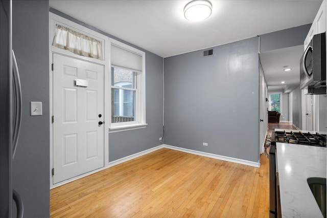 5000 N Glenwood Ave Unit 2, Chicago, IL 60640 - entryway with healthy amount of natural light and light wood-type flooring