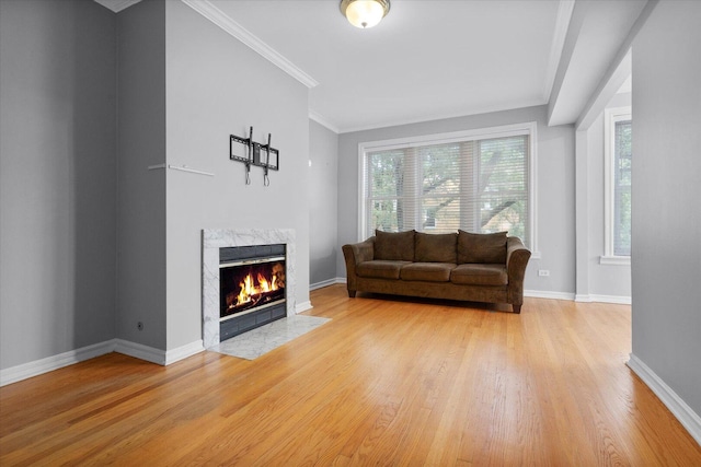 5000 N Glenwood Ave Unit 2, Chicago, IL 60640 - living room featuring light wood-style floors, a premium fireplace, and crown molding