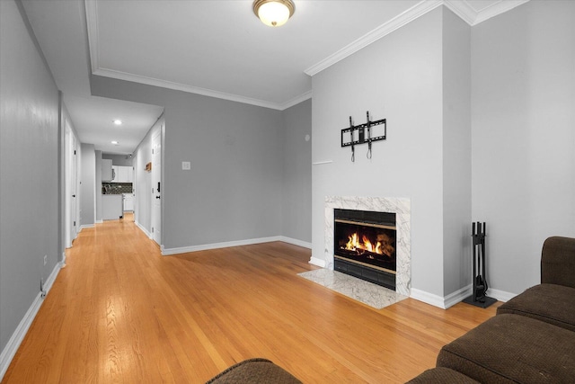 5000 N Glenwood Ave Unit 2, Chicago, IL 60640 - living room featuring light wood-style flooring, a premium fireplace, ornamental molding, and recessed lighting