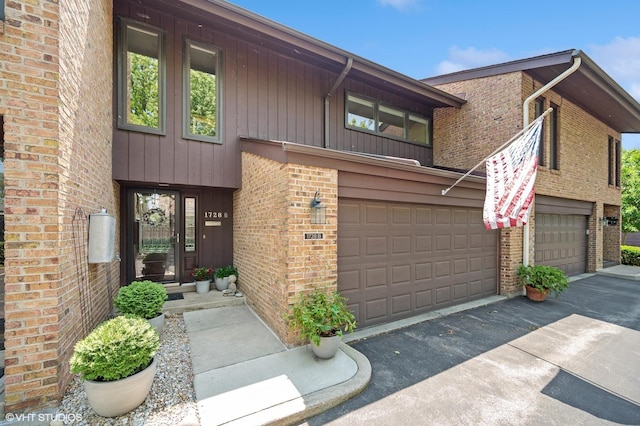 1728 Wildberry Dr Unit B, Glenview, IL 60025 - view of front of house with brick siding, concrete driveway, and a garage