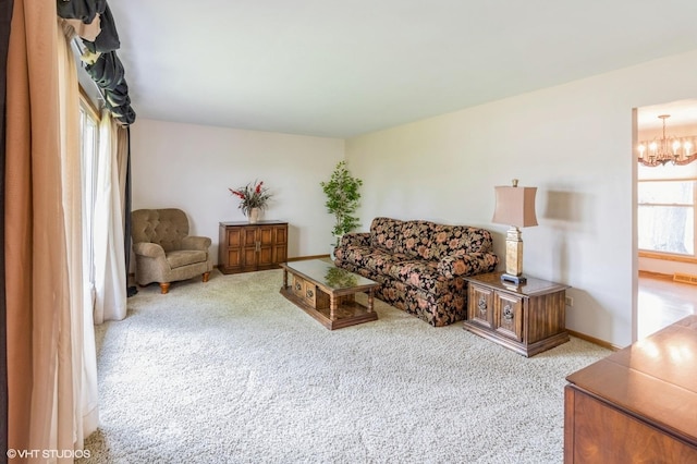 579 Figard Ln, Des Plaines, IL 60016 - carpeted living area featuring healthy amount of natural light and a chandelier