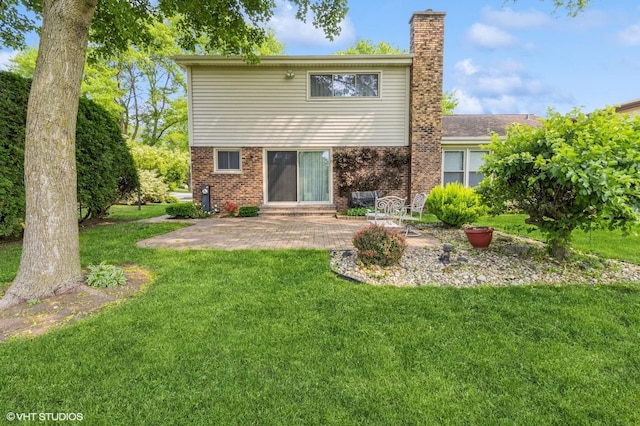 579 Figard Ln, Des Plaines, IL 60016 - back of house featuring a chimney, a patio, a lawn, and brick siding