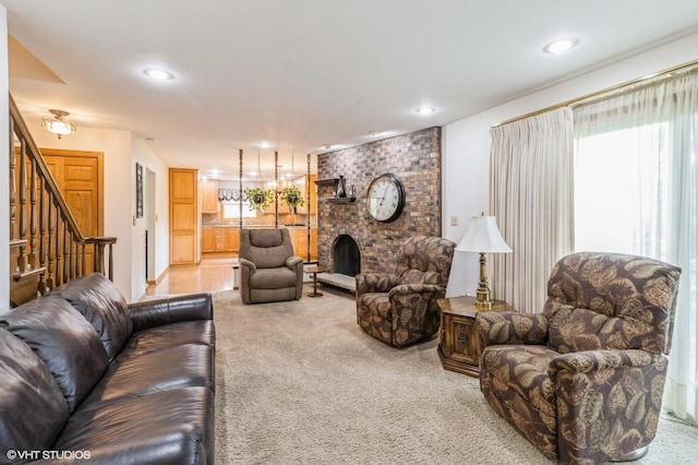 579 Figard Ln, Des Plaines, IL 60016 - living room with light carpet, plenty of natural light, a fireplace, stairs, and recessed lighting