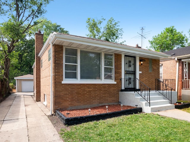 142 W Brayton St, Chicago, IL 60628 - view of front of house featuring a chimney, an outdoor structure, and brick siding