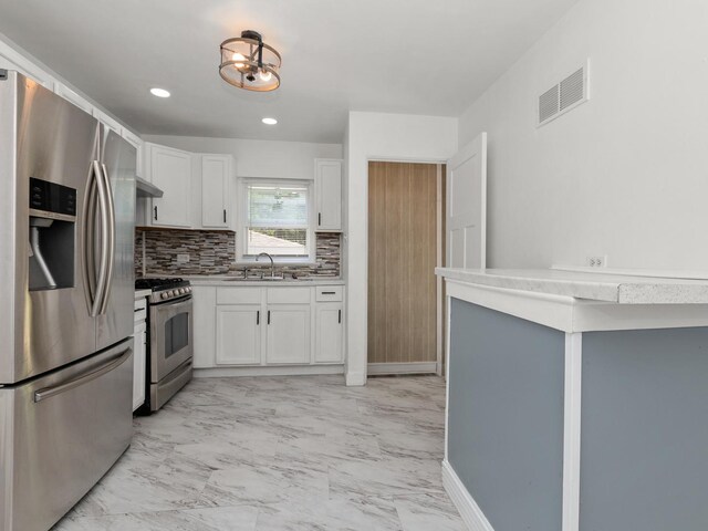 142 W Brayton St, Chicago, IL 60628 - kitchen with appliances with stainless steel finishes, light marble finish flooring, white cabinets, decorative backsplash, and recessed lighting