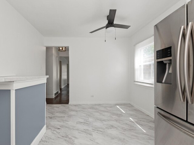 142 W Brayton St, Chicago, IL 60628 - unfurnished dining area featuring a ceiling fan and baseboards