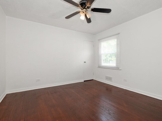 142 W Brayton St, Chicago, IL 60628 - unfurnished room with dark wood-type flooring, baseboards, and ceiling fan