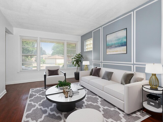 142 W Brayton St, Chicago, IL 60628 - living room with a textured ceiling, wood finished floors, and baseboards