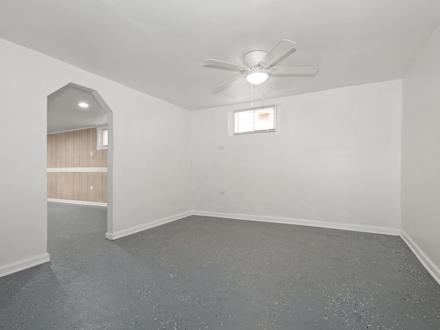142 W Brayton St, Chicago, IL 60628 - empty room featuring baseboards, arched walkways, and ceiling fan
