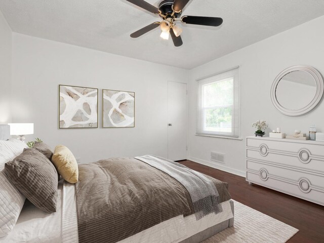 142 W Brayton St, Chicago, IL 60628 - bedroom with dark wood finished floors, baseboards, and ceiling fan