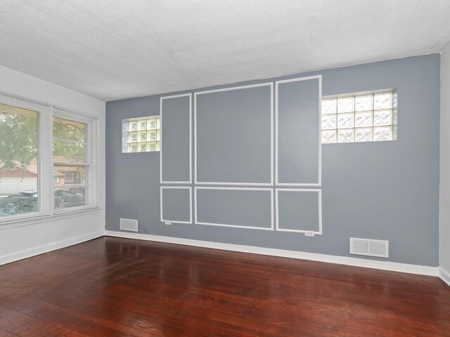 142 W Brayton St, Chicago, IL 60628 - empty room with wood-type flooring, baseboards, and a textured ceiling