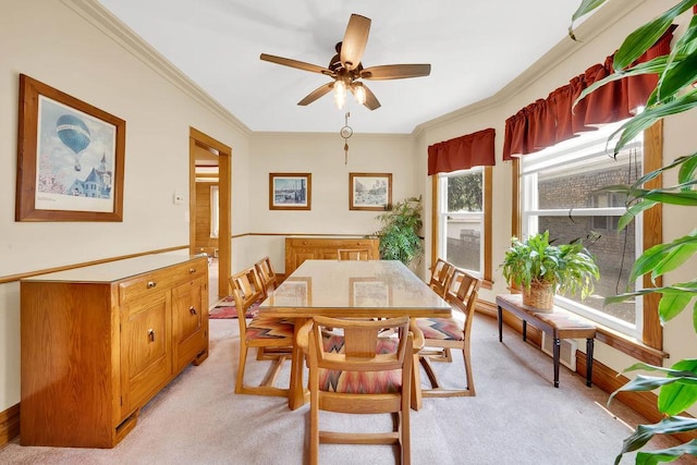 3235 Cuyler Ave, Berwyn, IL 60402 - dining room with light carpet, a ceiling fan, and crown molding