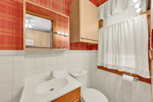 3235 Cuyler Ave, Berwyn, IL 60402 - bathroom with tile walls, vanity, and a ceiling fan