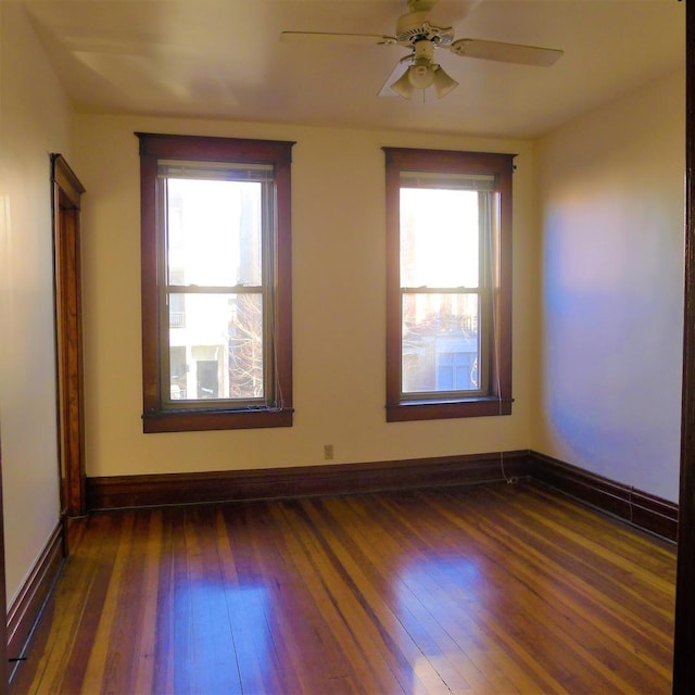 1020 N Wood St, Chicago, IL 60622 - empty room with dark wood-style floors, healthy amount of natural light, and ceiling fan