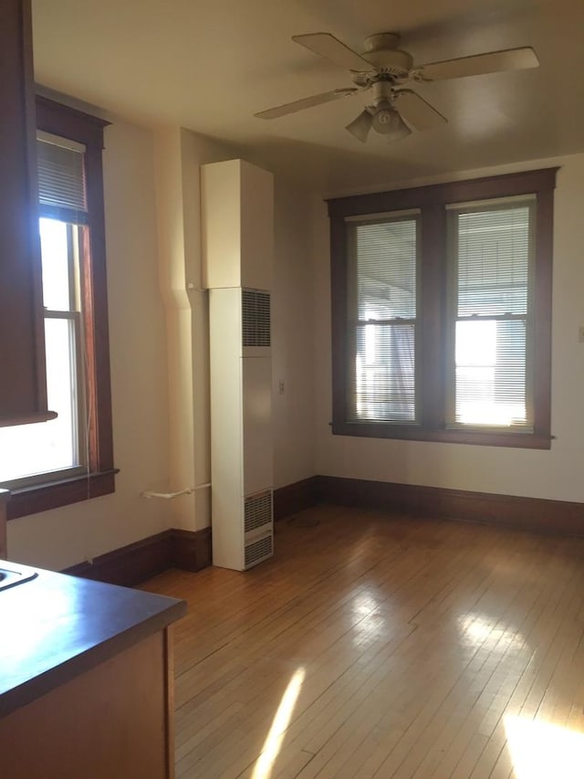 1020 N Wood St, Chicago, IL 60622 - unfurnished living room with ceiling fan, light wood-type flooring, and a heating unit