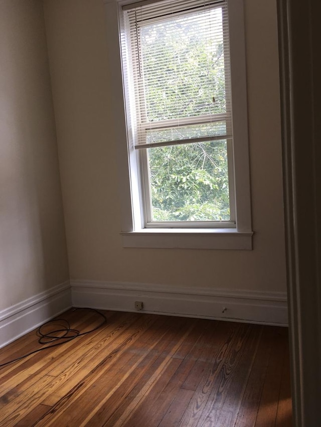 1020 N Wood St, Chicago, IL 60622 - spare room with dark wood-type flooring and baseboards
