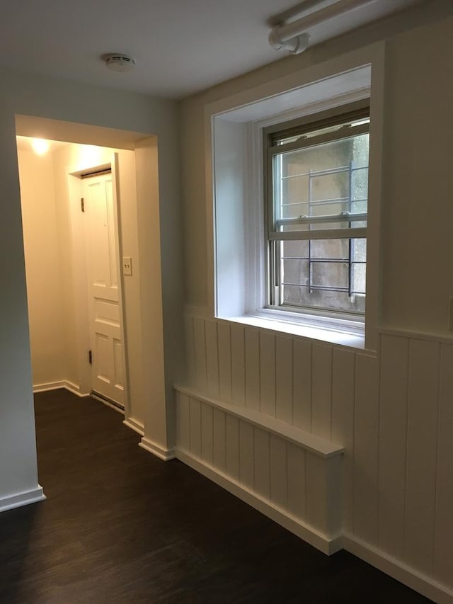 1020 N Wood St, Chicago, IL 60622 - unfurnished room featuring dark wood-style flooring and a wainscoted wall