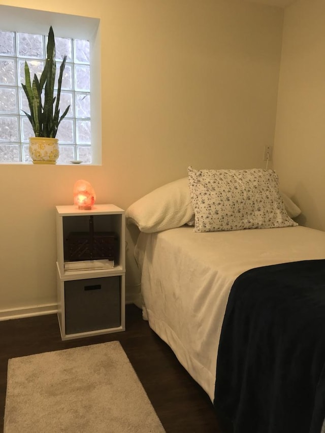 1020 N Wood St, Chicago, IL 60622 - bedroom with dark wood-style floors and baseboards