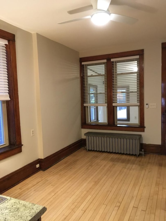 1020 N Wood St, Chicago, IL 60622 - unfurnished room featuring radiator, ceiling fan, and light wood finished floors