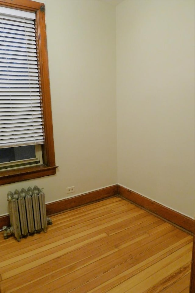 1020 N Wood St, Chicago, IL 60622 - empty room featuring radiator and light wood-type flooring