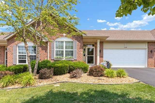 17228 Fontana Ln, Lockport, IL 60441 - single story home featuring brick siding, asphalt driveway, and a garage