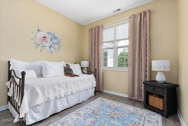 17228 Fontana Ln, Lockport, IL 60441 - bedroom featuring wood finished floors and baseboards
