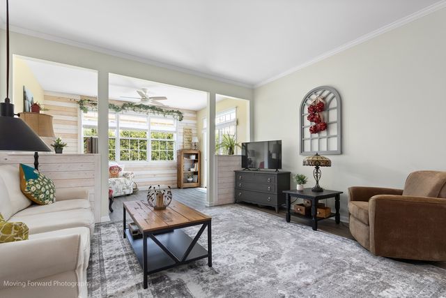 17228 Fontana Ln, Lockport, IL 60441 - living room featuring ornamental molding, wood finished floors, and ceiling fan
