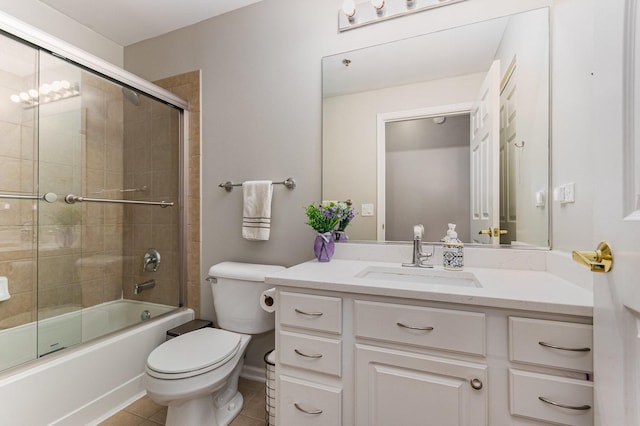 390 W Mahogany Ct Unit 301, Palatine, IL 60067 - bathroom featuring toilet, vanity, combined bath / shower with glass door, and tile patterned flooring