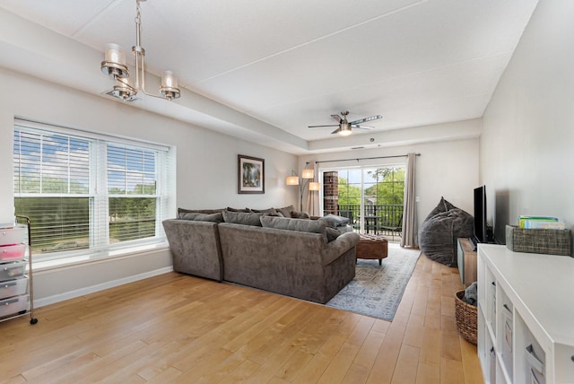 390 W Mahogany Ct Unit 301, Palatine, IL 60067 - living area with light wood finished floors, a chandelier, a ceiling fan, and baseboards