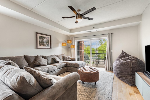 390 W Mahogany Ct Unit 301, Palatine, IL 60067 - living area with a ceiling fan and light wood-style flooring