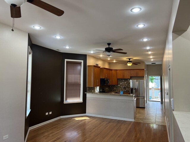 5722 S Aberdeen St, Chicago, IL 60621 - kitchen featuring stainless steel fridge with ice dispenser, ceiling fan, backsplash, recessed lighting, and brown cabinets