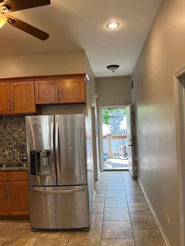 5722 S Aberdeen St, Chicago, IL 60621 - kitchen featuring stainless steel fridge with ice dispenser, brown cabinets, backsplash, and a ceiling fan