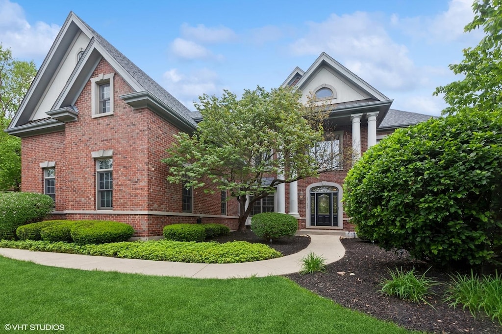 39W445 S Mathewson Ln, Geneva, IL 60134 - greek revival inspired property with brick siding and a front yard