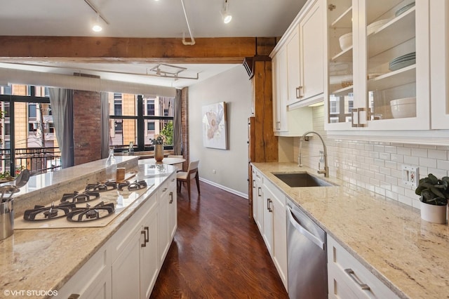 520 W Huron St Unit 220, Chicago, IL 60654 - kitchen featuring stainless steel dishwasher, white gas stovetop, track lighting, dark wood finished floors, and tasteful backsplash