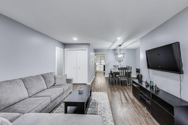 2131 N Harlem Ave Unit 231, Chicago, IL 60707 - living area with wood finished floors, a chandelier, baseboards, and recessed lighting