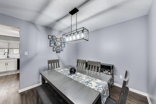 2131 N Harlem Ave Unit 231, Chicago, IL 60707 - dining space featuring dark wood-type flooring and baseboards