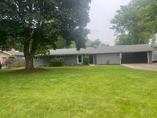 1130 N Randall Rd, Aurora, IL 60506 - single story home with a garage, a front yard, and concrete driveway