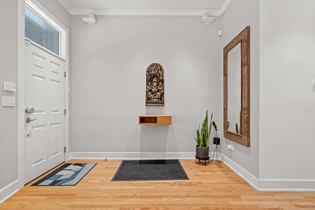 2113 N Clark St, Chicago, IL 60614 - entrance foyer featuring crown molding, wood finished floors, and baseboards