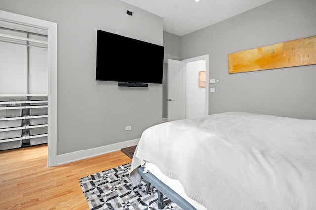 2113 N Clark St, Chicago, IL 60614 - bedroom with wood finished floors, a closet, and baseboards